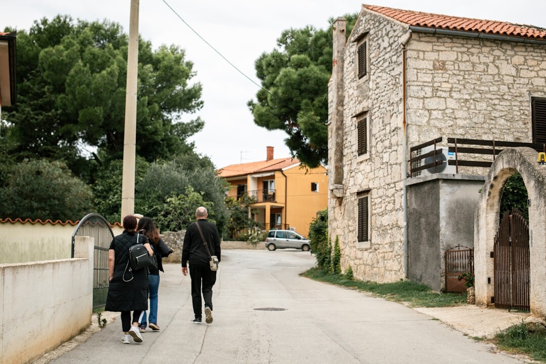 Small documentary team interviewing a local resident outdoors in Croatia