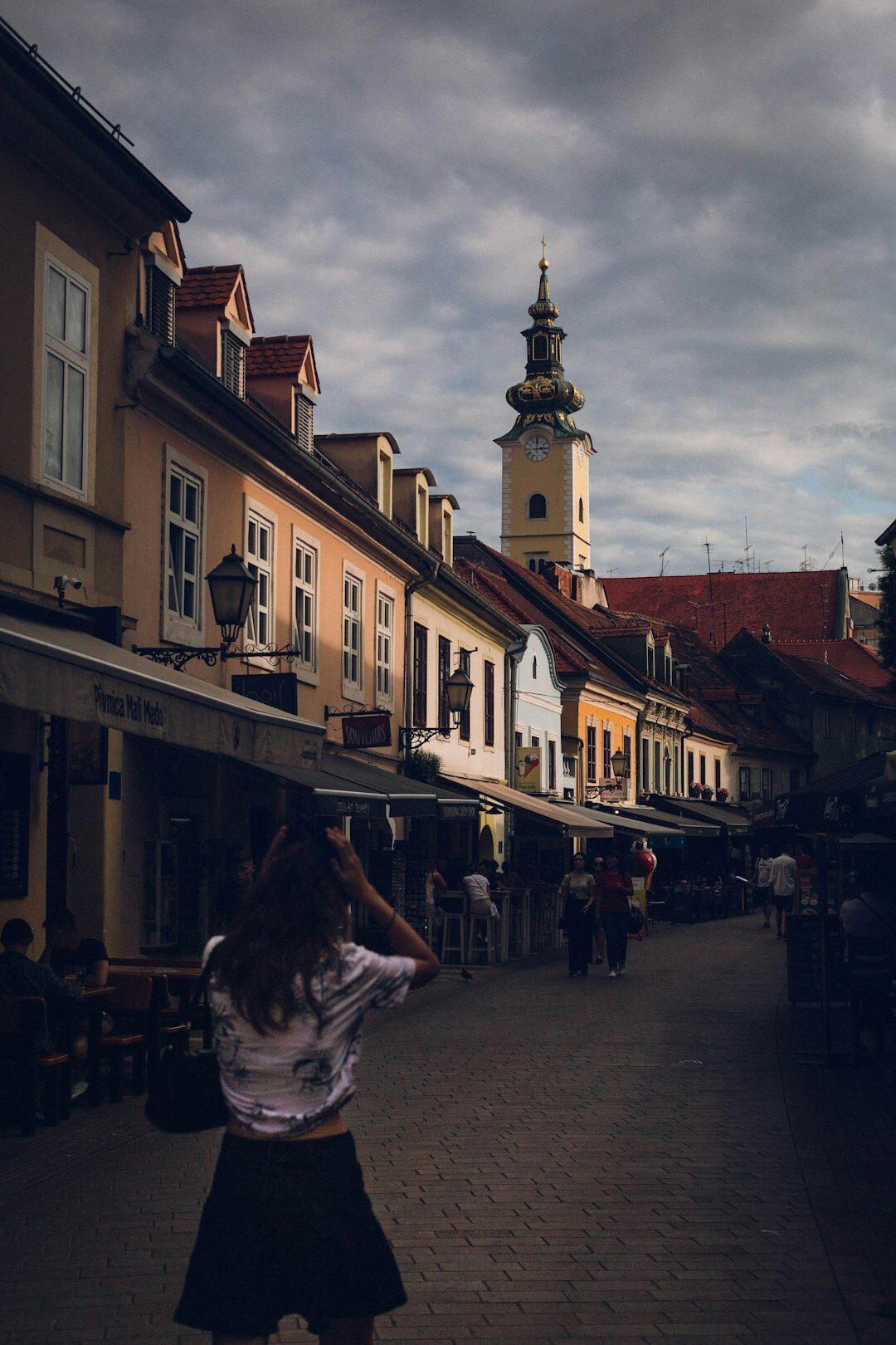 Young Croatian street musician playing guitar in Zagreb old town
